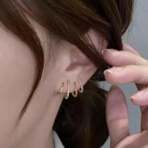 Golden rhinestone claw huggie korean earrings